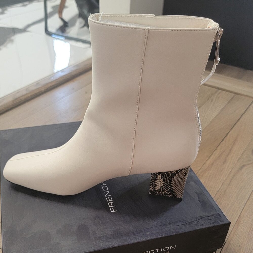 White booties with snakeskin heel